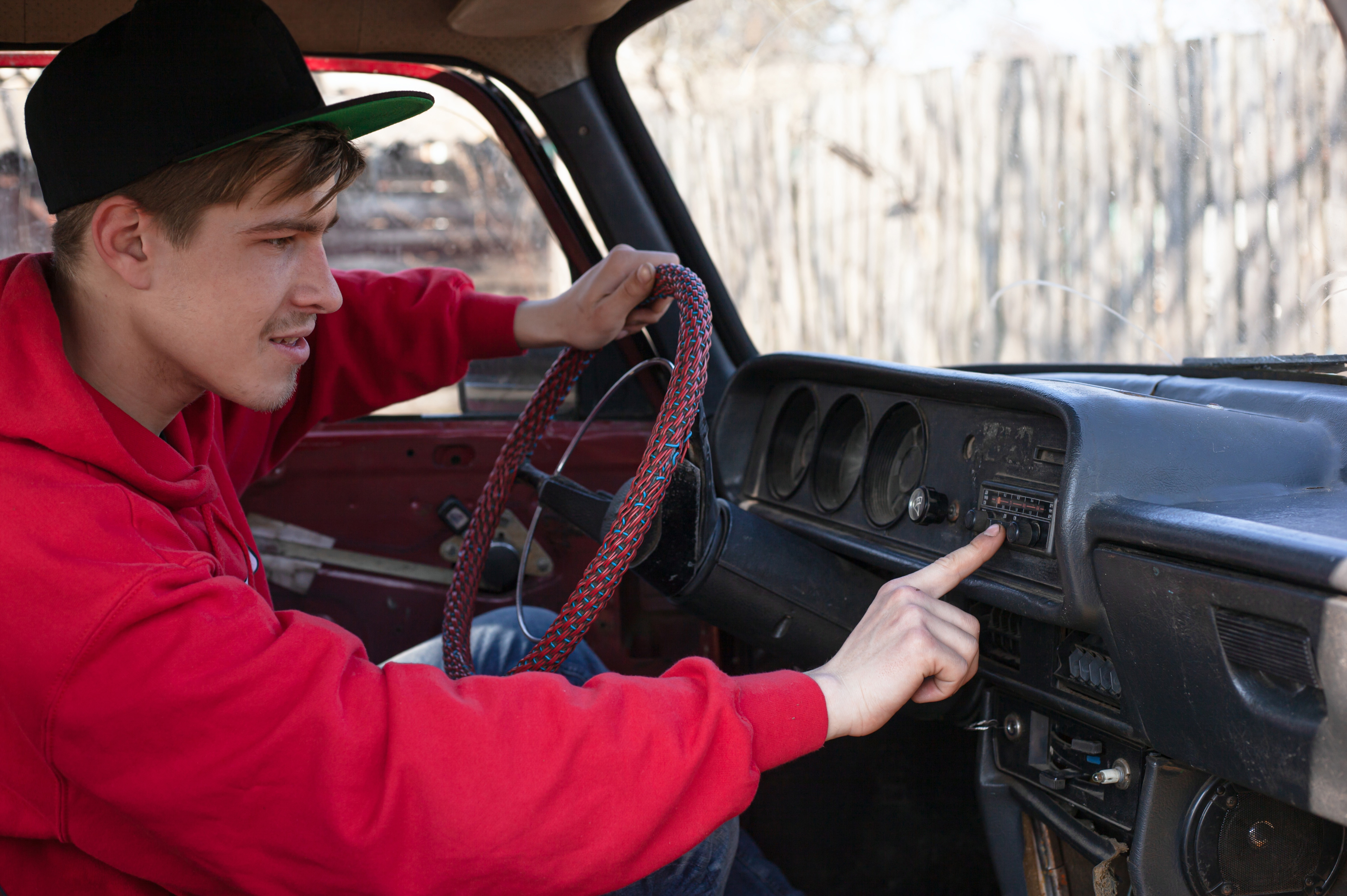 Driver looking at dashboard warning lights